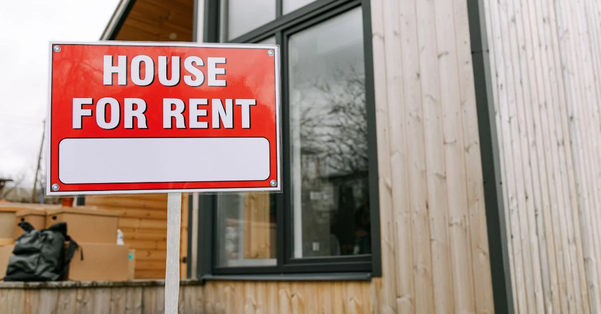 A sign that reads House for Rent