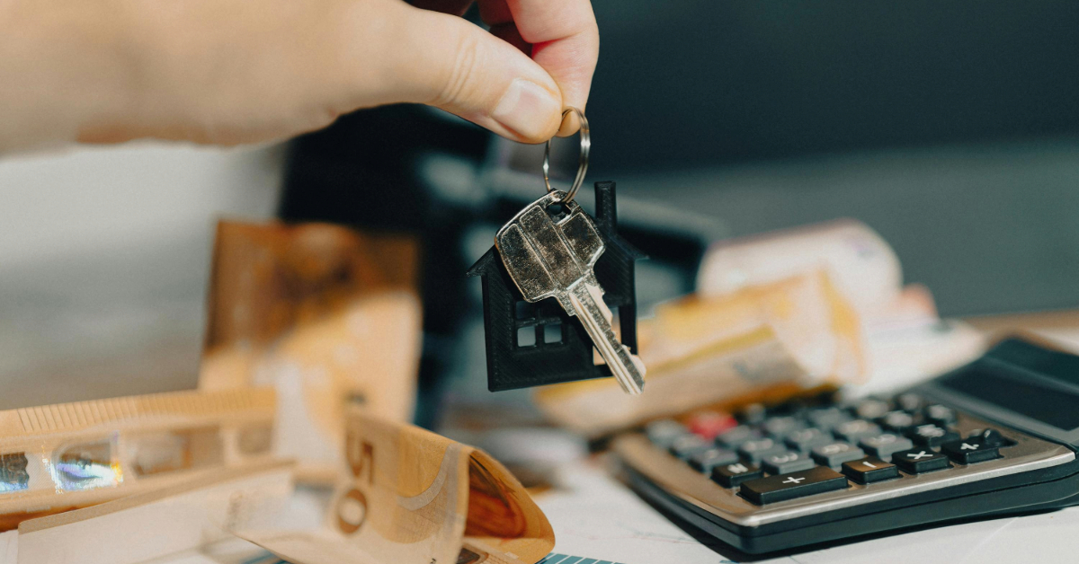 A person picking up house keys after reviewing Dubai rent payment rules