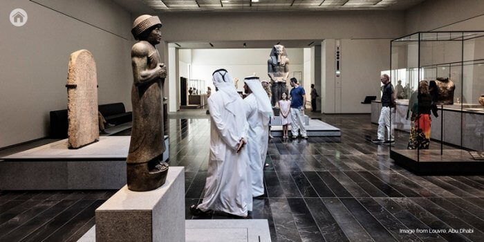 People viewing artwork in Louvre Abu Dhabi