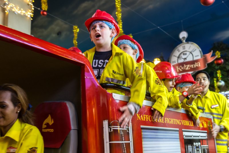 Kidzania is a place where kids learn about different professions through role-playing.