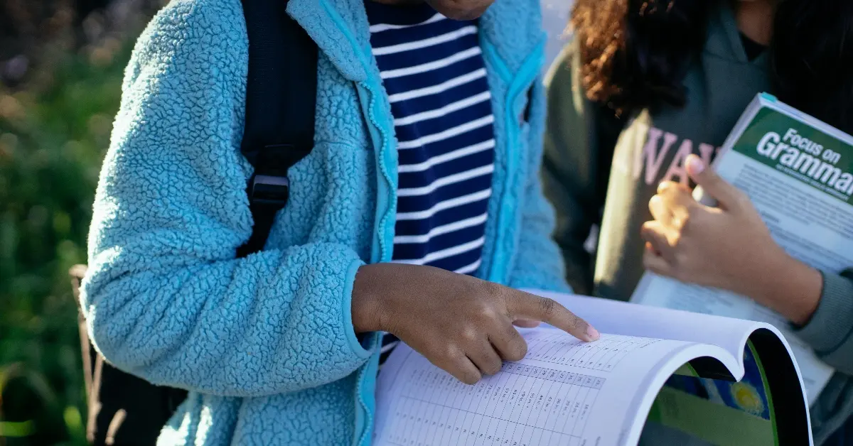 Students reading textbook