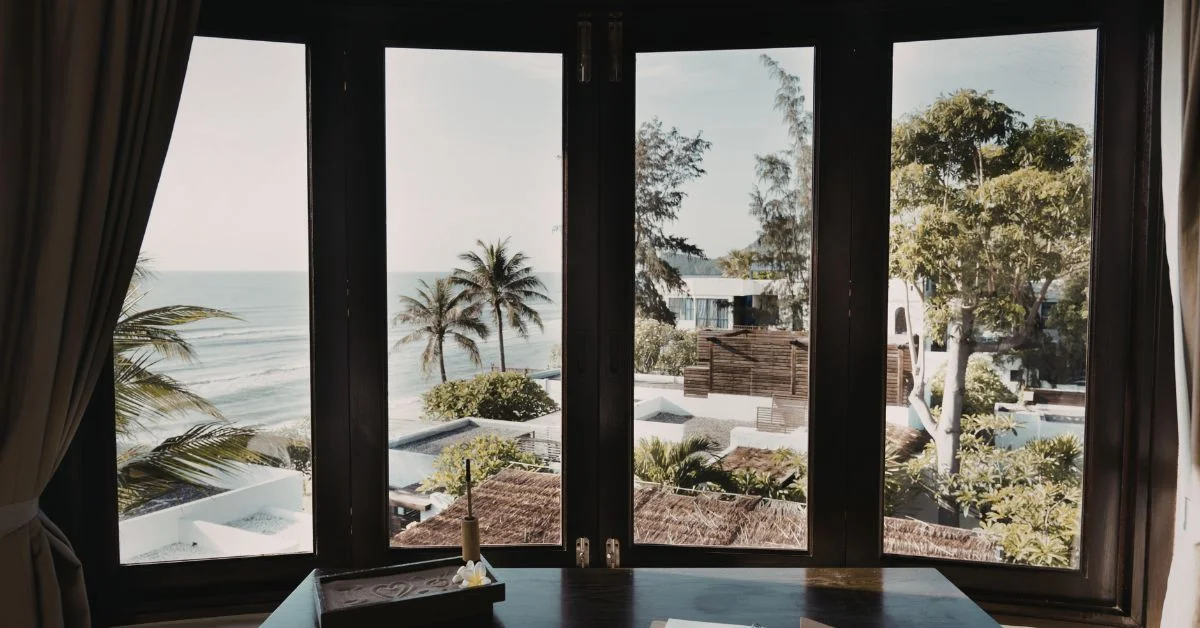 A scenic beach front view from a hotel room