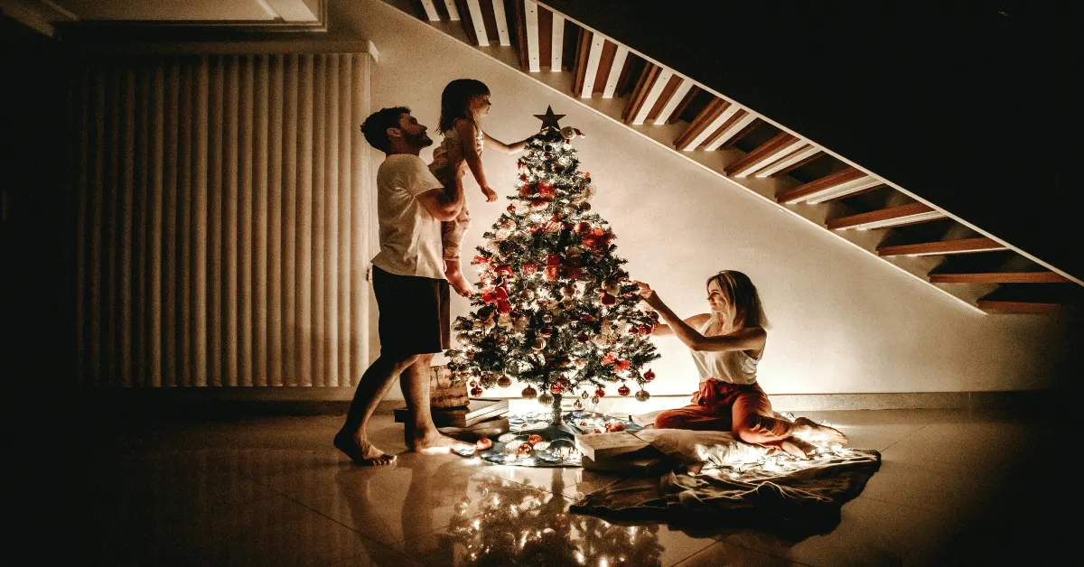 A family Decorating a Christmas Tree together