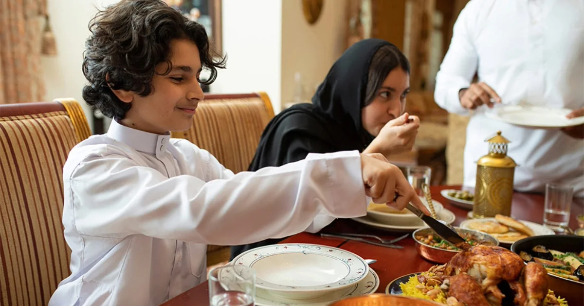Family breaking their fast in a restaurant in Dubai
