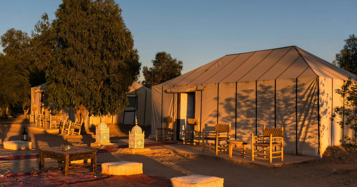 A beautiful shot of sunlight streaming over the camp, casting a warm and cozy glow