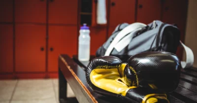 Boxing gloves on bench in locker room