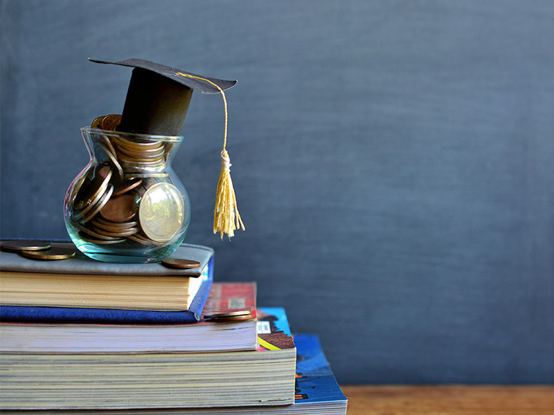 graduation hat on coins 