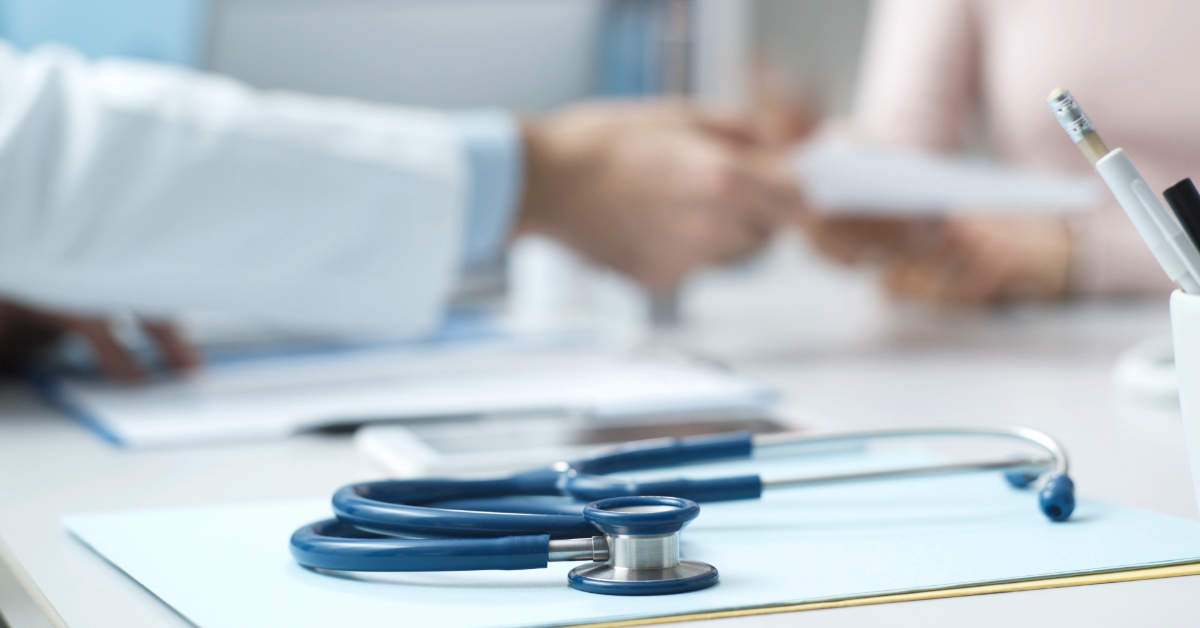 doctor consulting patient in clinic