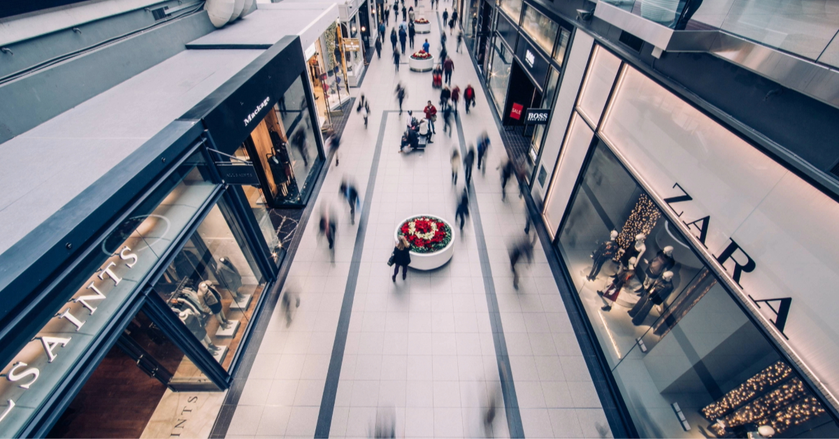 People shopping inside Al Hamra Mall