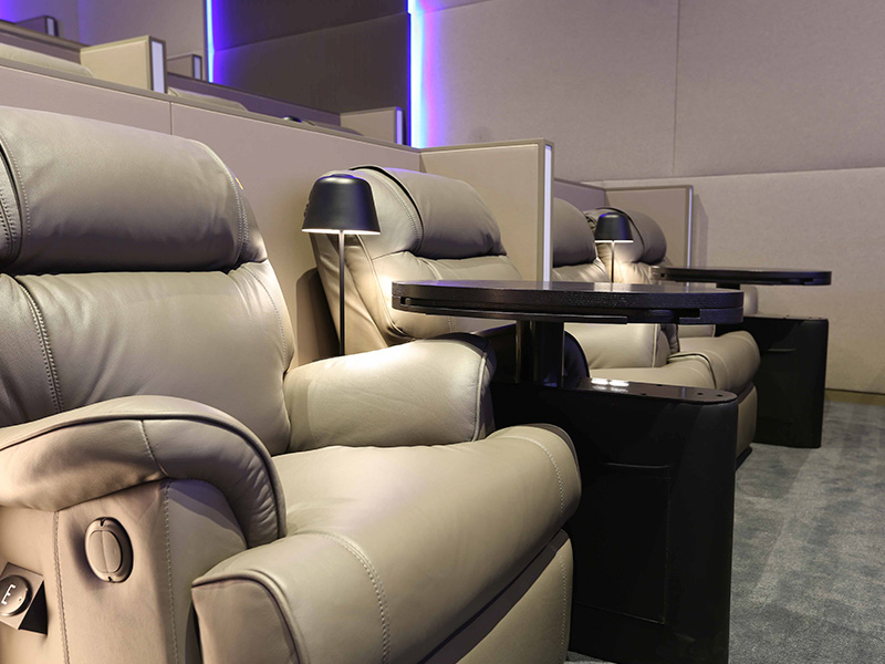 reclining seats with side table in Roxy Cinemas 