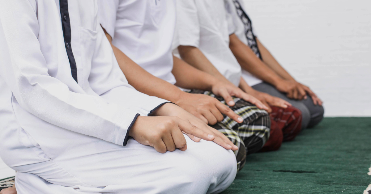 A row of people praying