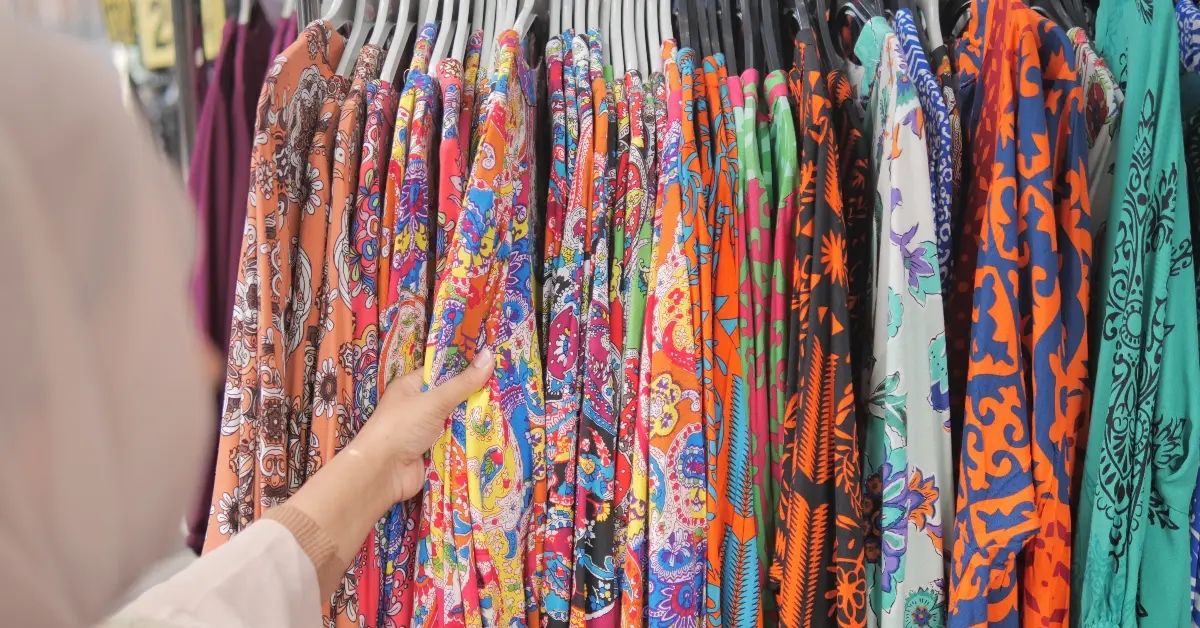 woman choosing Abaya in a shop