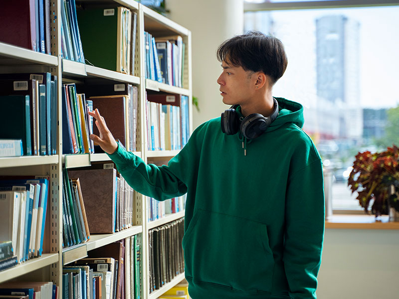 student at library