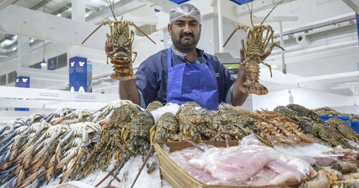 A man selling fish in a market