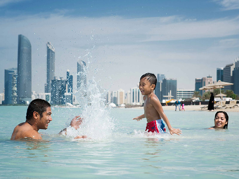 swimming in Abu Dhabi Corniche 