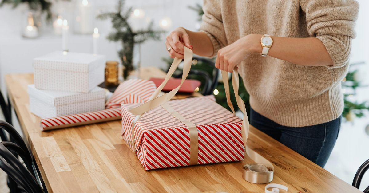 A woman unboxing a Mother’s Day gift