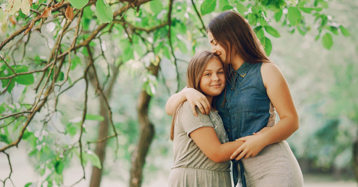 A mother and daughter celebrating Mother’s Day outside