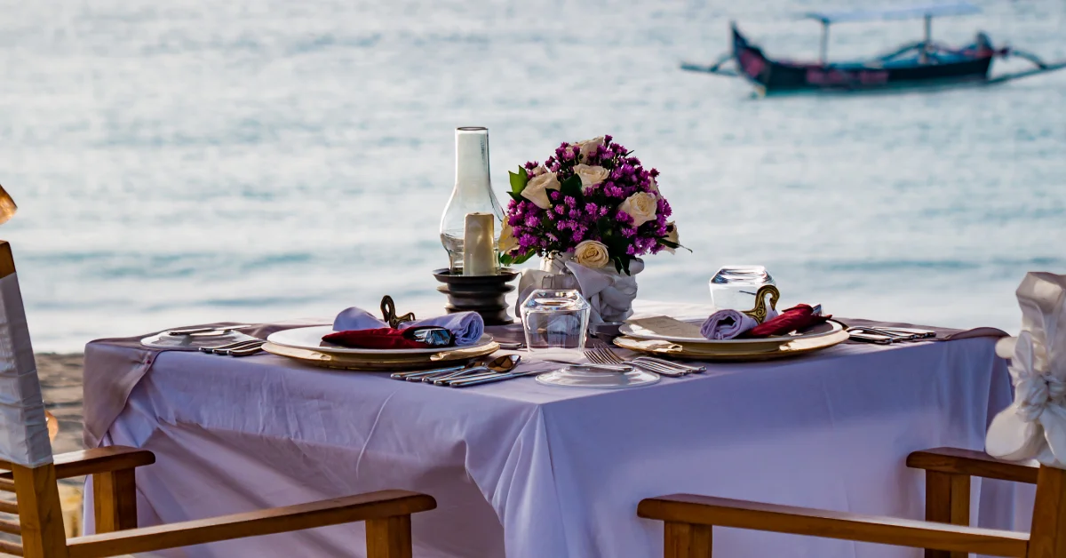 romantic dinner setting on a beach in Dubai