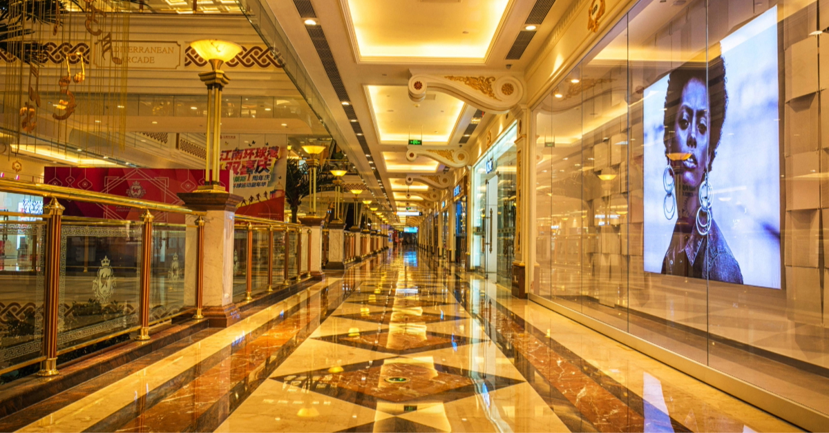 A long mall corridor at night with lights illuminated