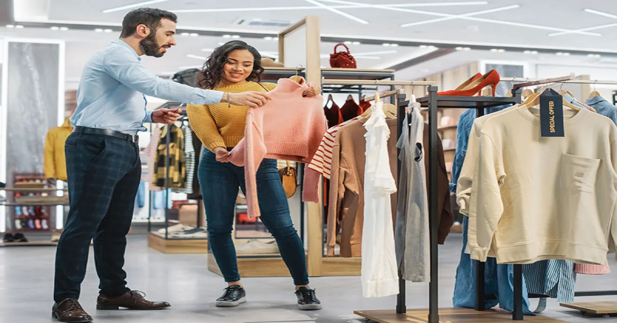 A couple choosing clothes together at the mall