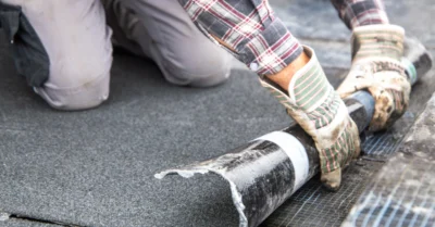 Roofer during waterproofing work