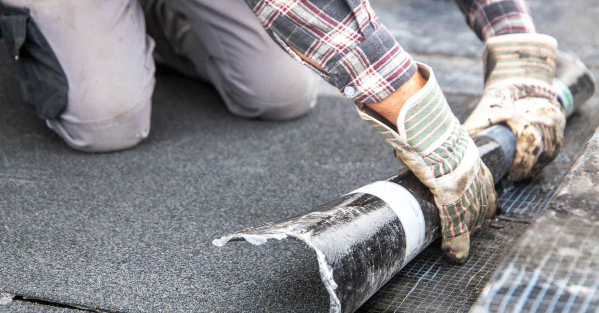 Roofer during waterproofing work