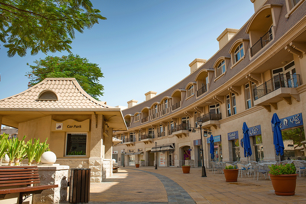 Image of a beige shopping mall building