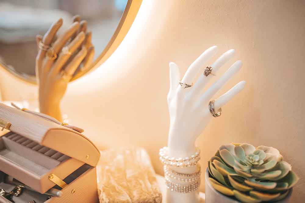 Jewellery collection displayed in a hand statue.