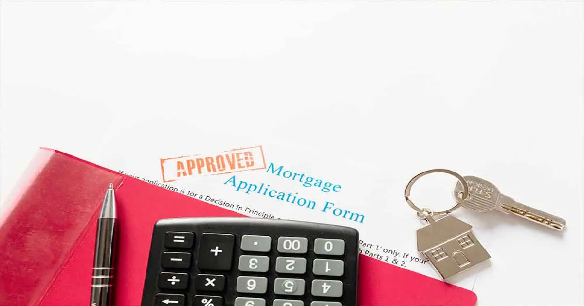 Mortgage application form, key, pen and calculator