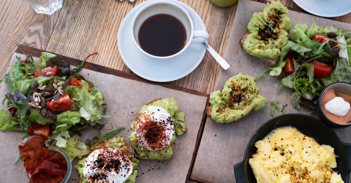 fresh delicious food and a cup of coffee on a wooden table