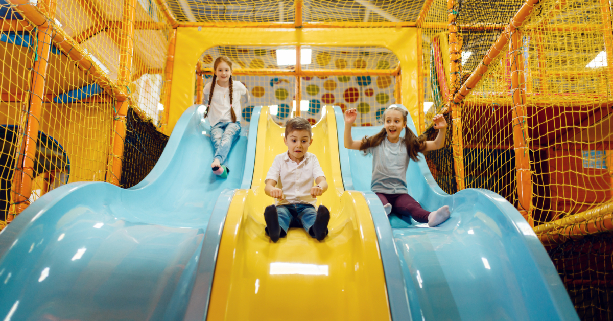 Kids sliding in one of the best indoor play areas inn Abu Dhabi