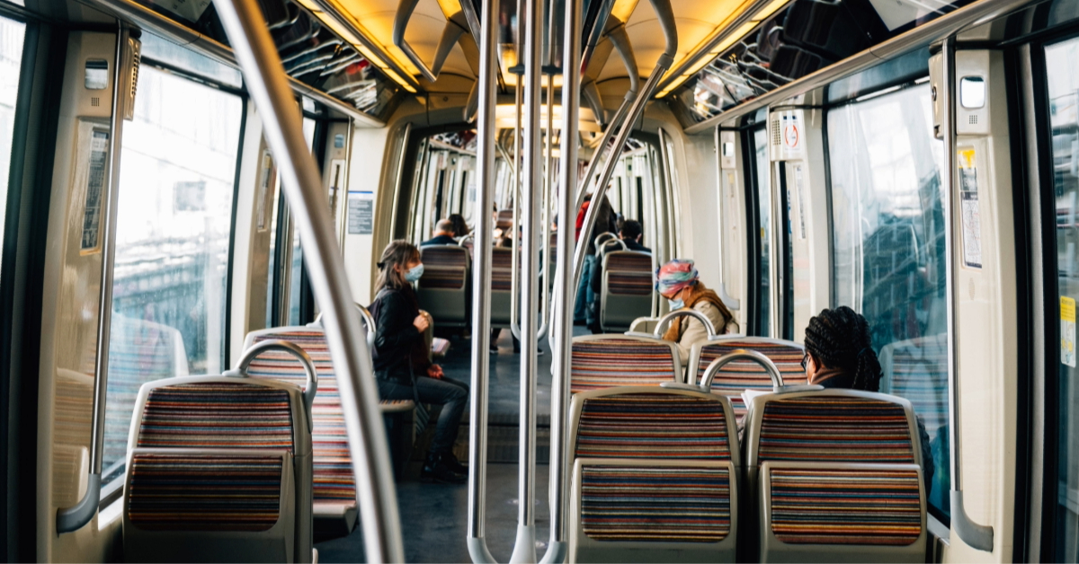 People sitting inside a bus going from Abu Dhabi to Oman