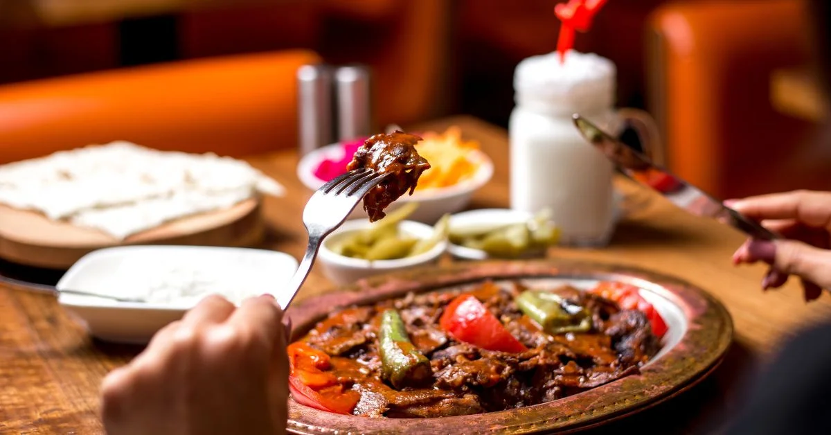 Someone eating one of the Most Popular Lebanese Dishes