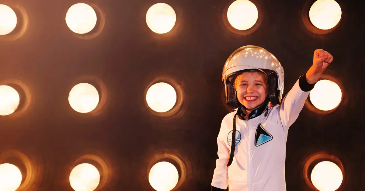 Kid pretending to be an astronaut in Kidzania Abu Dhabi