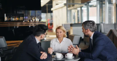 People having meeting in a cafe