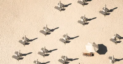 empty sunbeds and umbrellas on a sandy beach