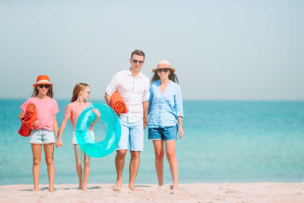 Family at a public beach in dubai