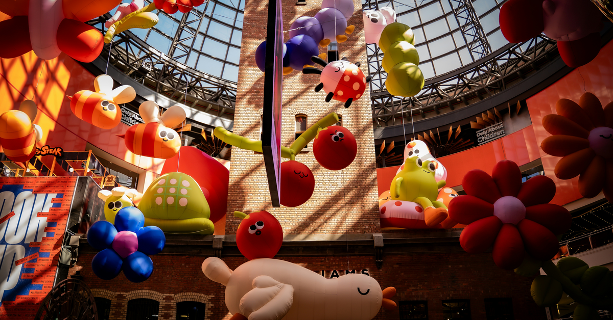 Inflatable cartoon characters hanging from the ceiling