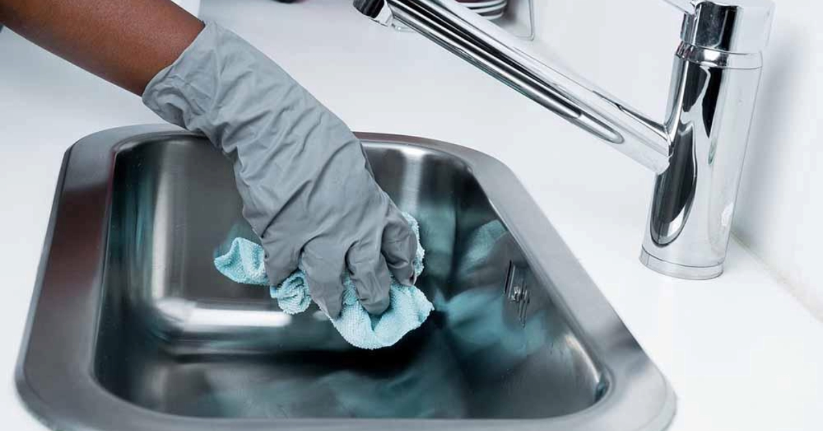 A maid cleaning the kitchen