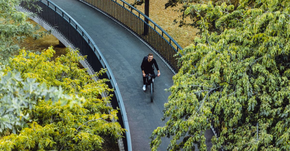 A man cycling at the park
