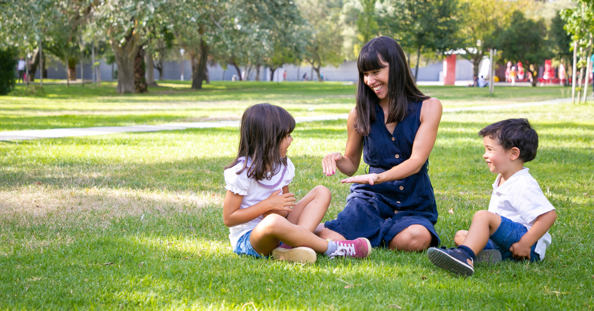 Happy mother with kids enjoying in the park