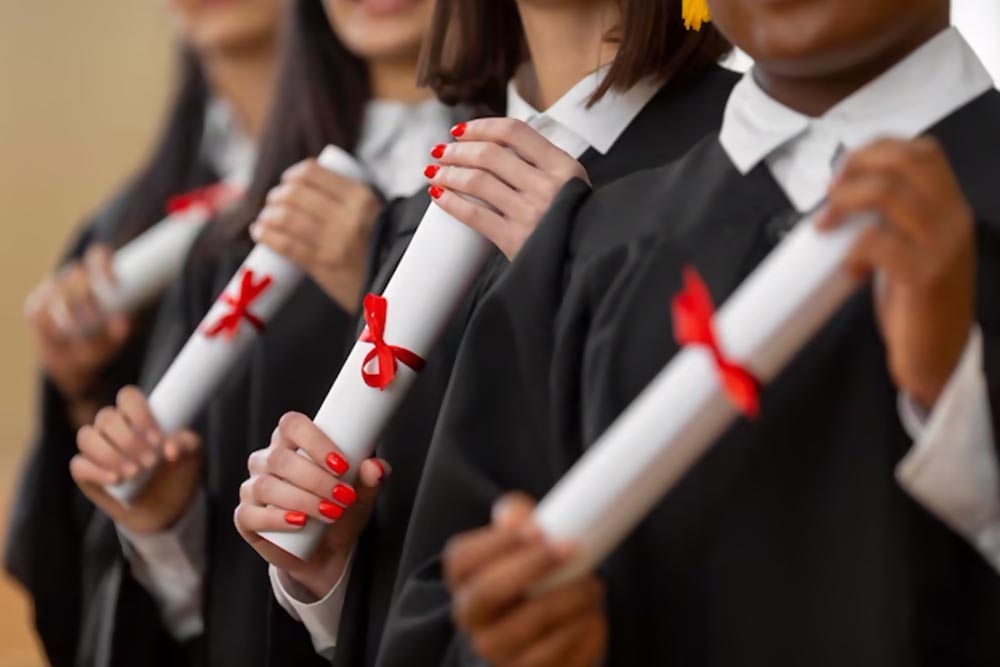Students holding their degrees