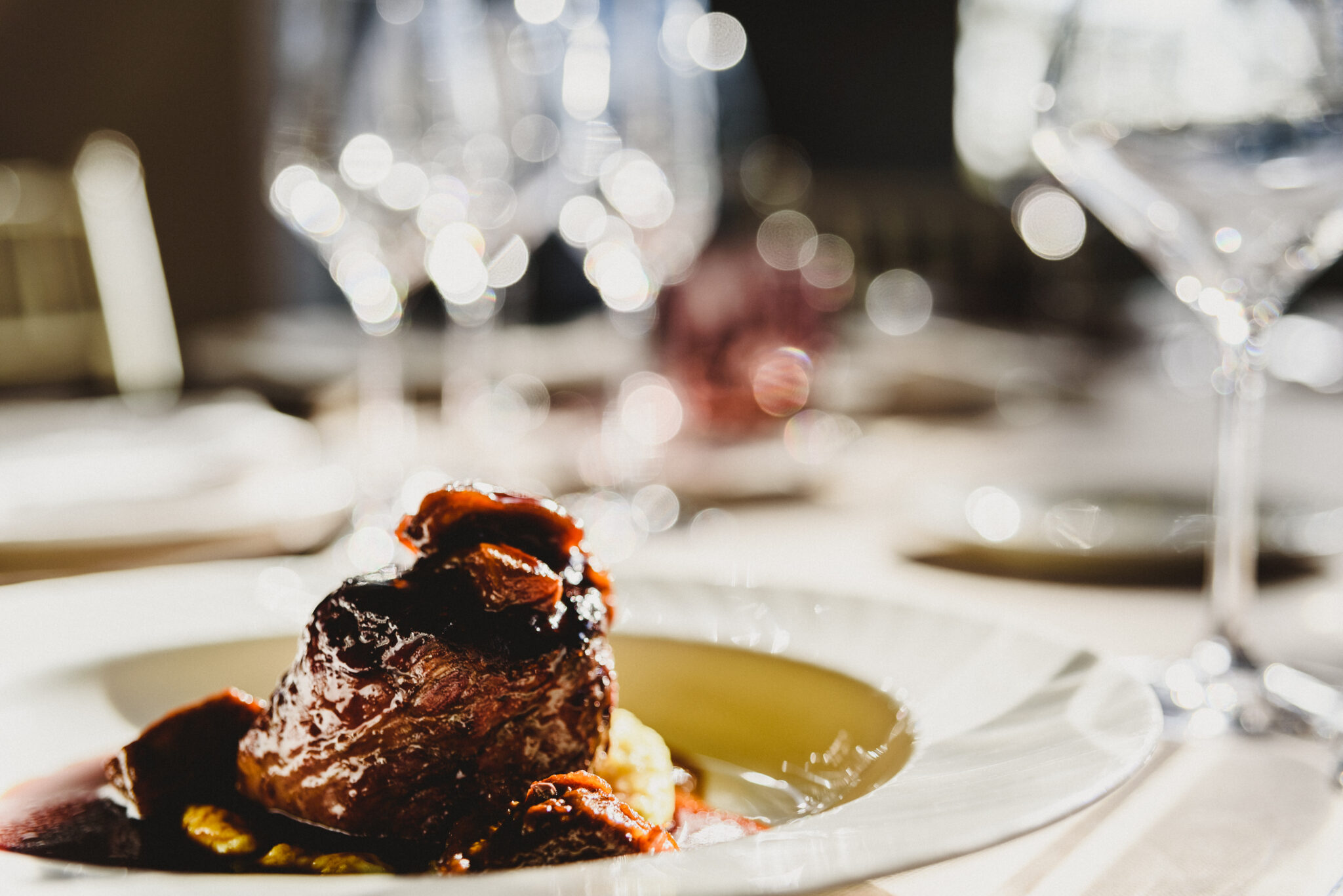 veal dish with sauce served in luxury cutlery