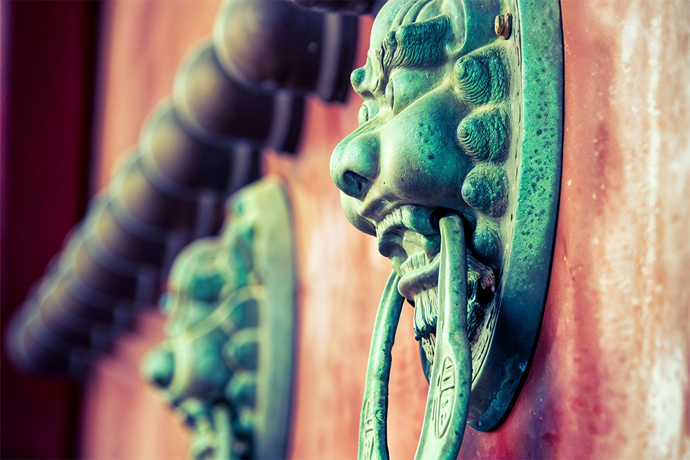 ornamented door handles featuring chinese decor 