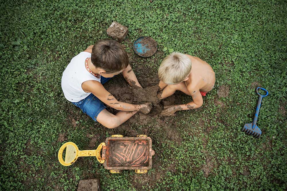 kids playing in Mud with toys