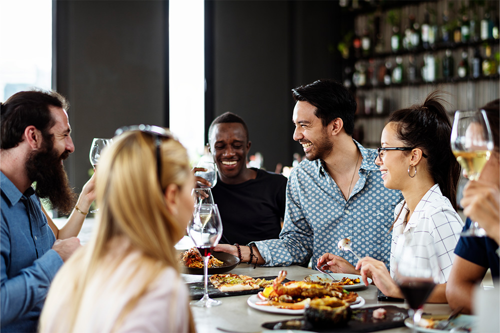 Group of friends in a restaurant in Discovery Gardens