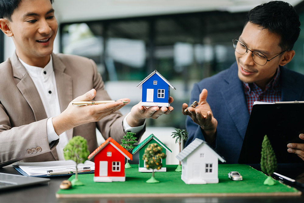 Salesmen explaining residential real estate investing
