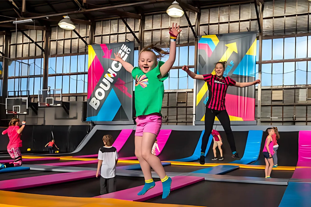 Kids jumping on Bounce at the play park