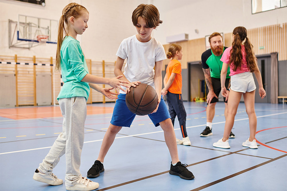 Kids playing basketball in Just Play Sports Complex