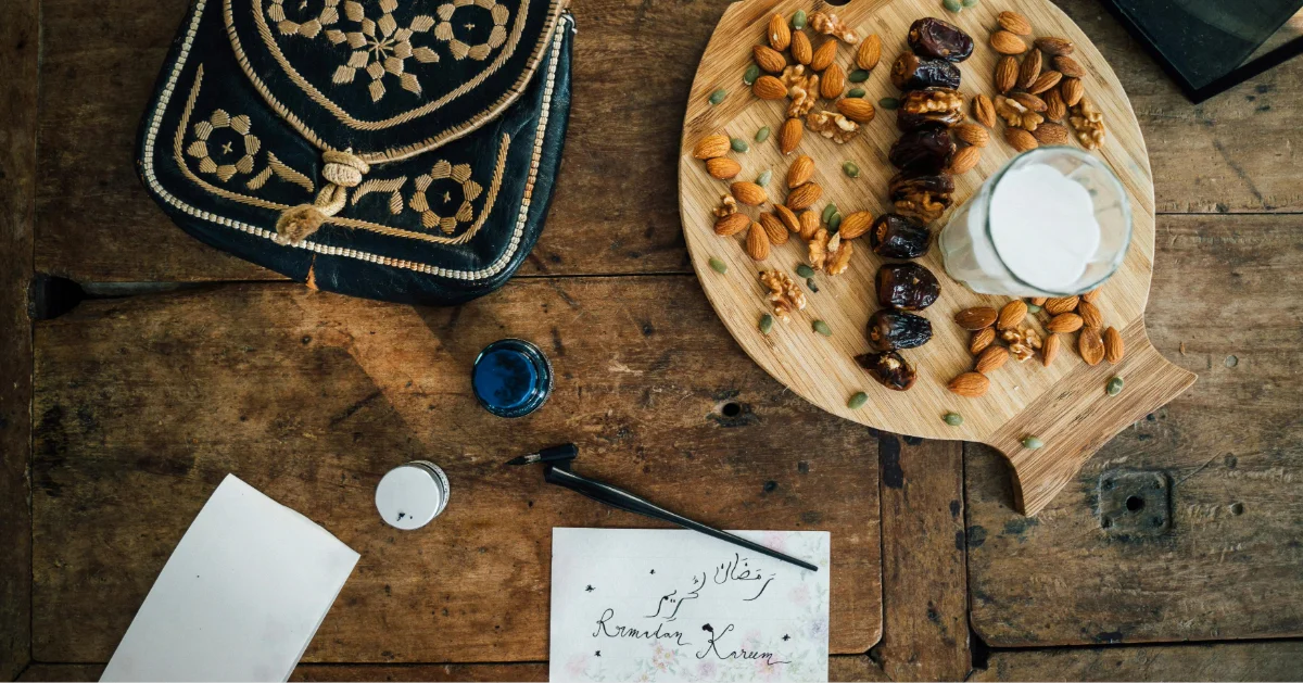 Nuts, dates, and a note with Ramadan Kareem written on it in English and Arabic